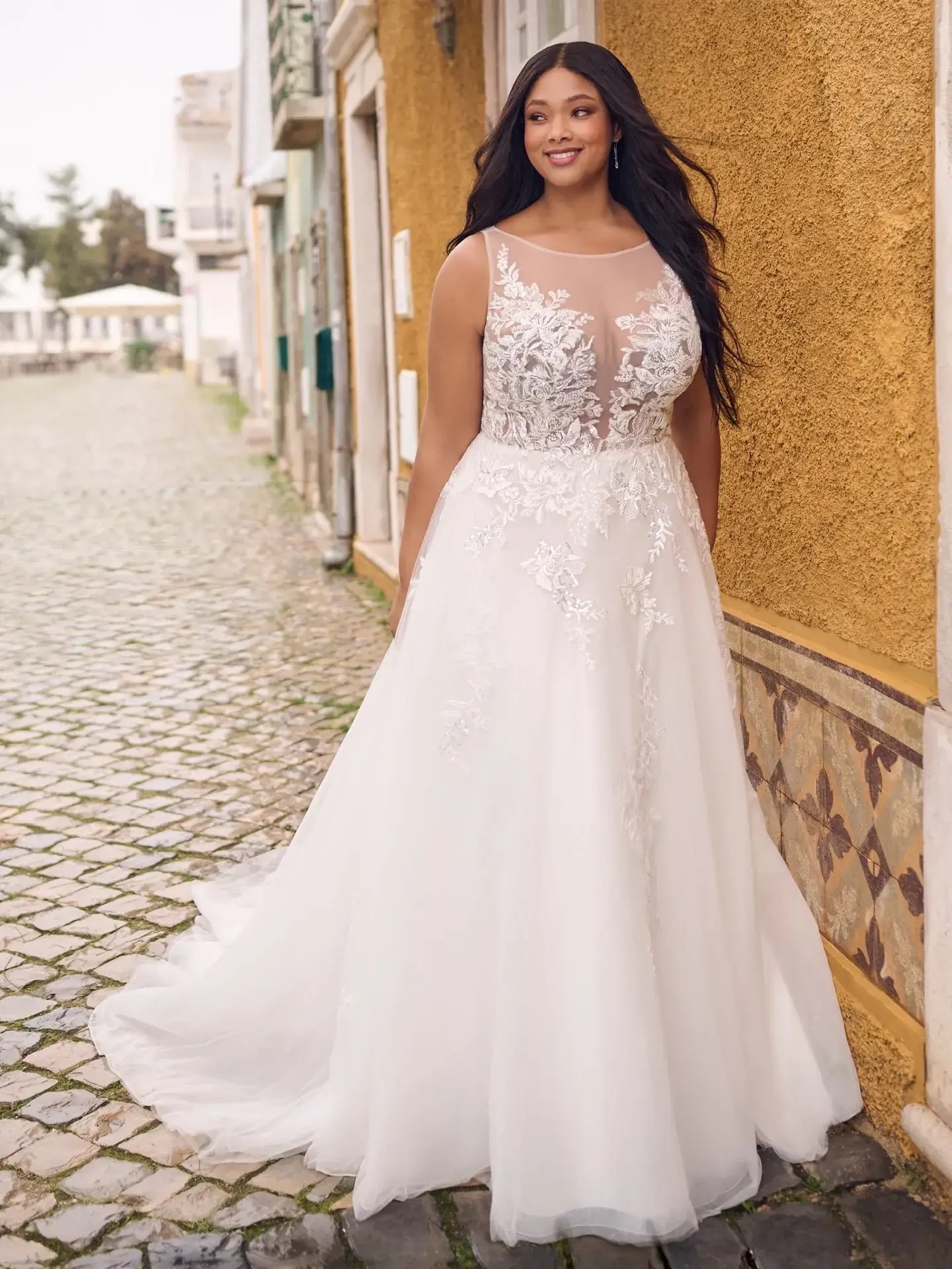 Model wearing a plus size gown