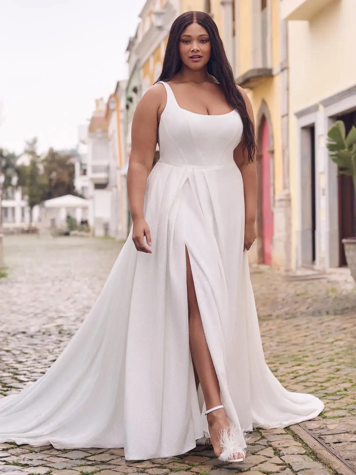 Model wearing a plus size gown