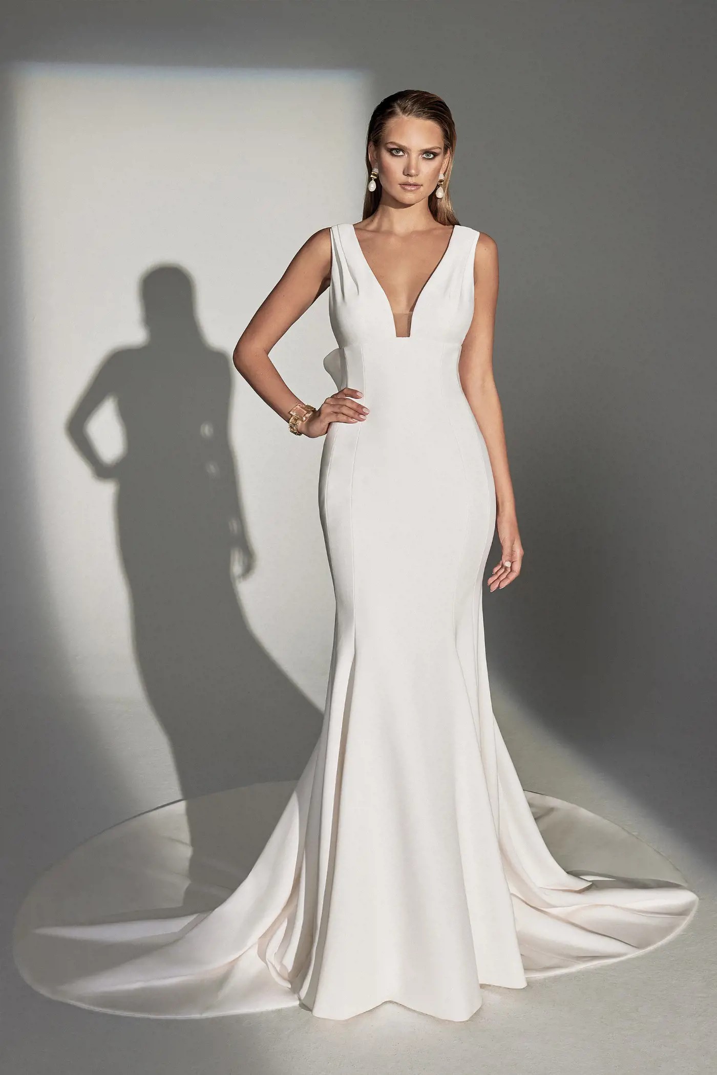 Model wearing a gown by Justin Alexander Signature. Desktop image