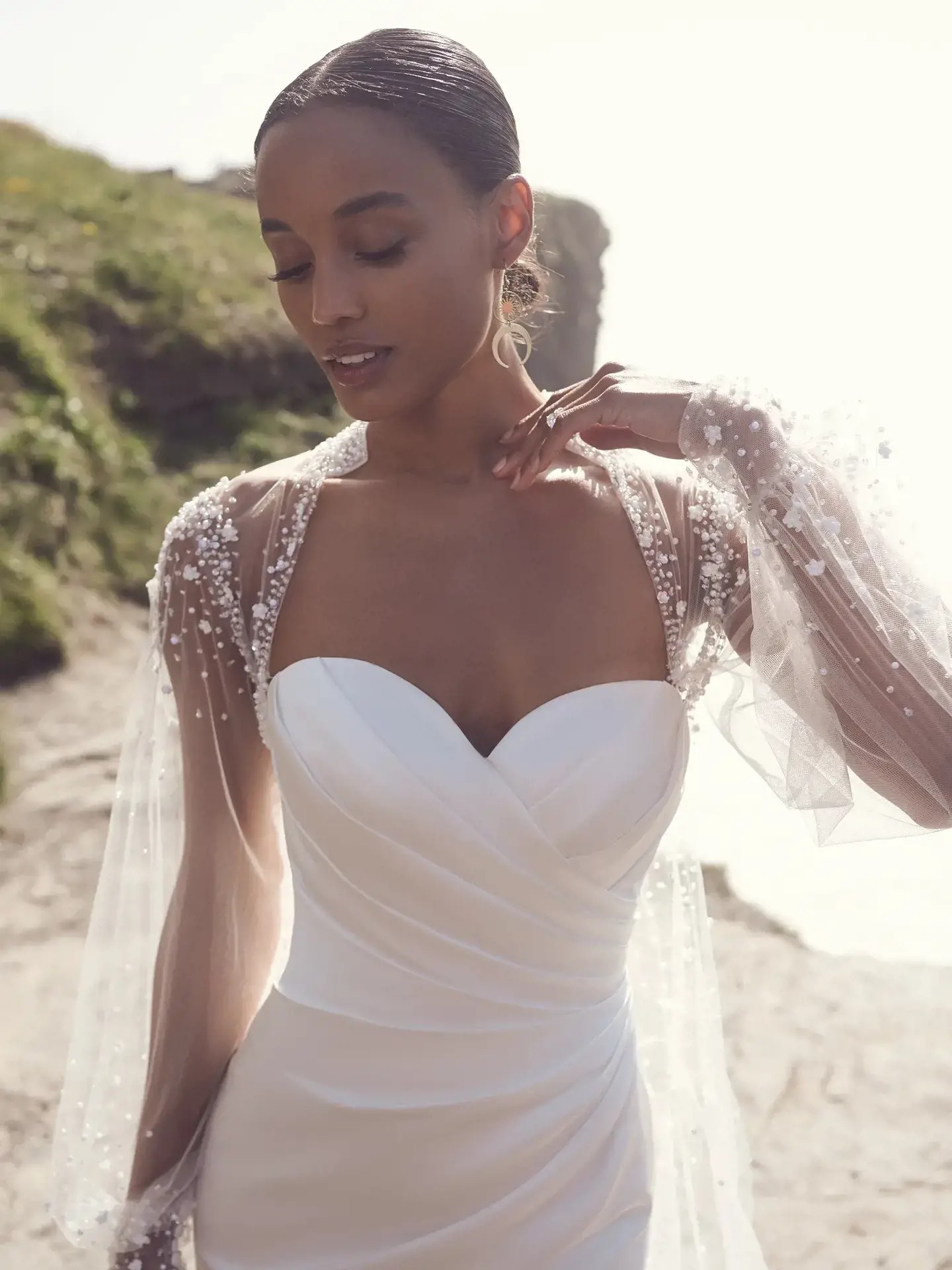 Model wearing a gown by Rebecca Ingram. Desktop image