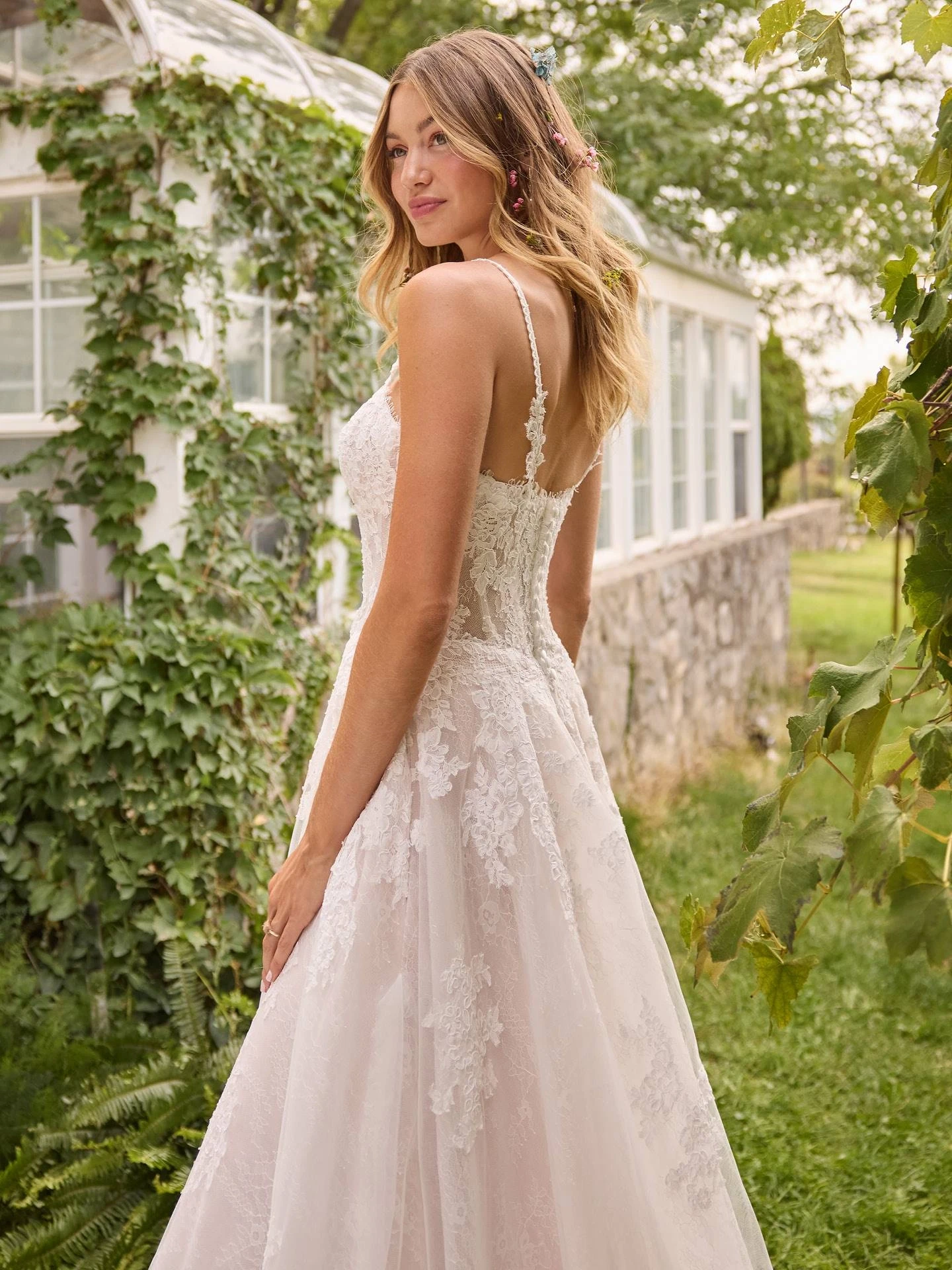 Model wearing a gown by Rebecca Ingram