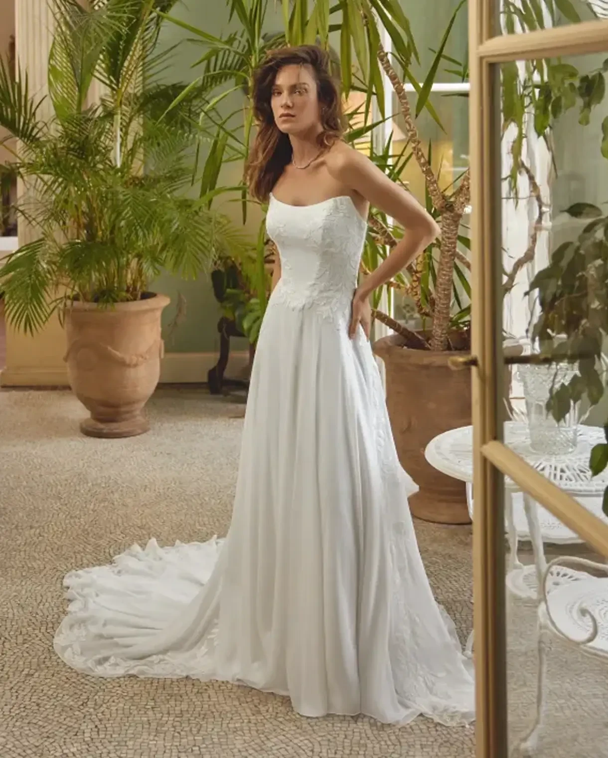Model wearing a Justin Alexander gown