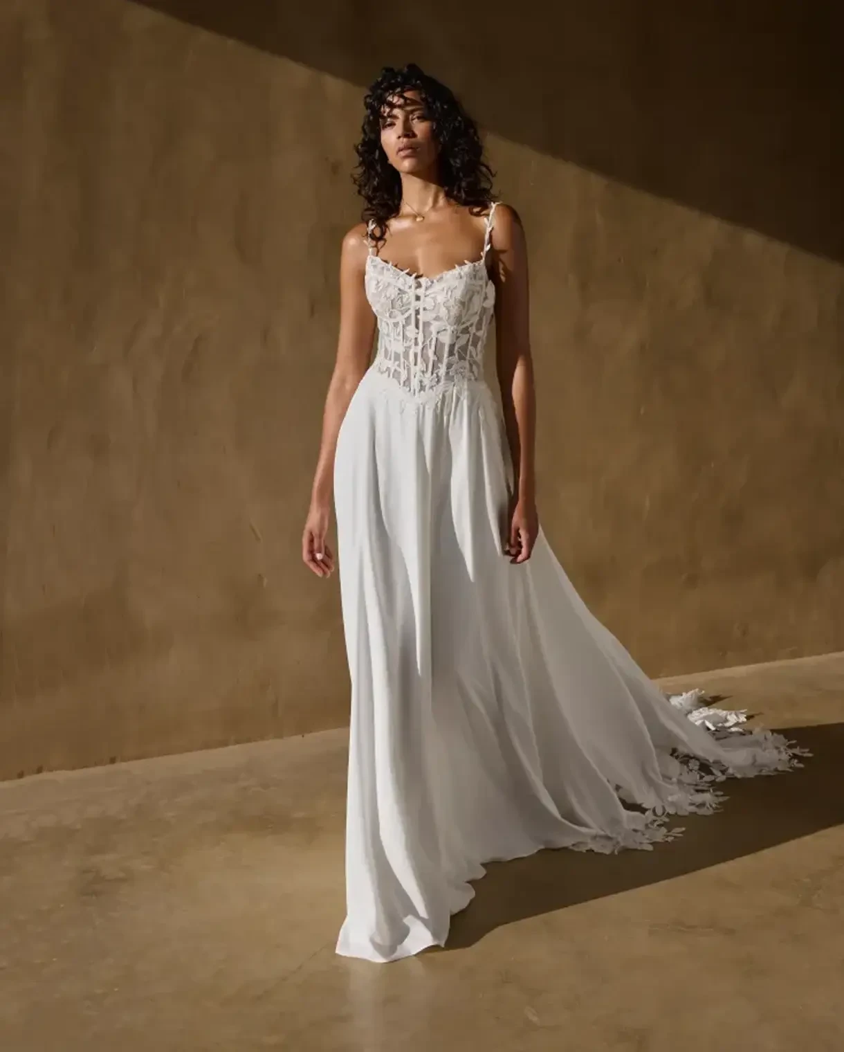 Model wearing a Lillian West gown
