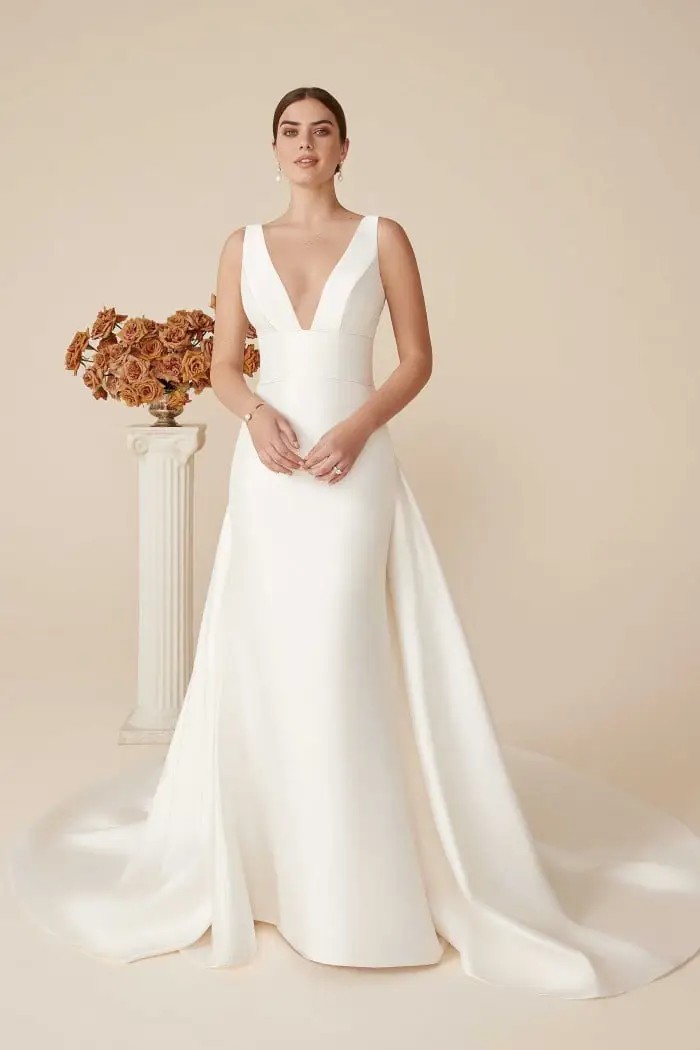 Model wearing a Justin Alexander gown
