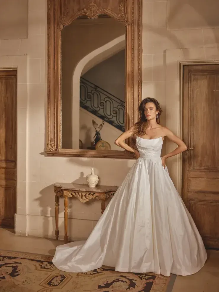 Model wearing a Justin Alexander gown